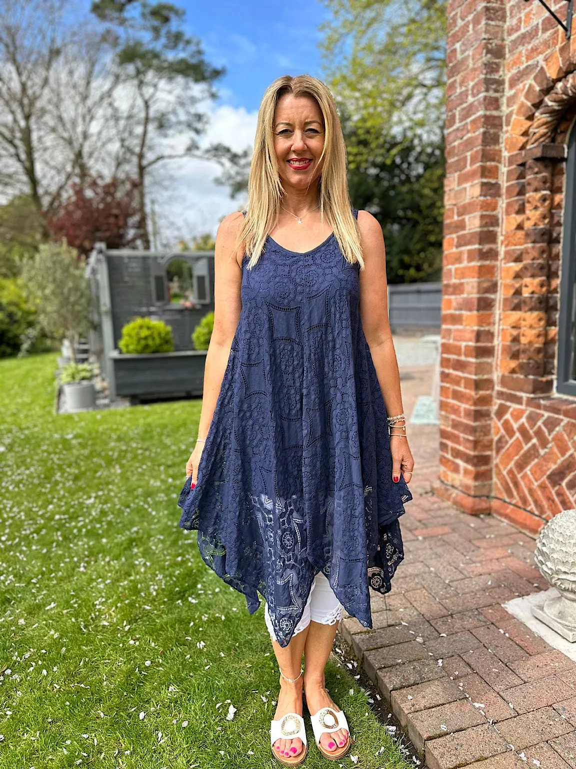 Navy Lace V Neck Dress Tuscany can be rewritten as Blue Lace Dress with V Neckline in Tuscany.